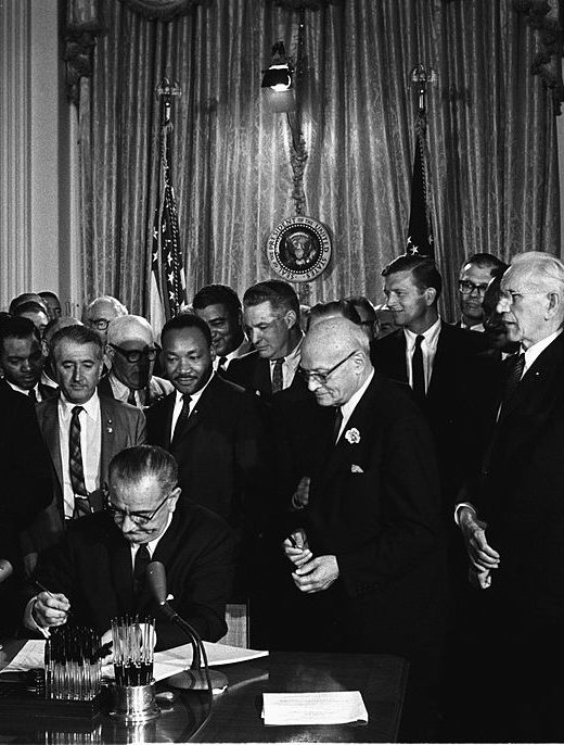 Lyndon Johnson signing 1964 Civil Rights Act